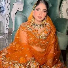 Another portrait of my orange fall bride. The warm tones of her makeup and outfit are perfectly matched with the green and red stones in her Kundan necklace.