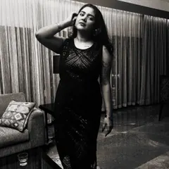 Another shot from the "Tasveer" promo series. This black and white photo captures a more candid, thoughtful moment in a stylish setting.