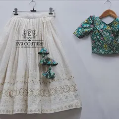 This is the product view of one of my popular mother-daughter sets. It shows the fine chikankari work on the white skirt and the detailed print of the matching puff-sleeve blouse, complete with custom tassels.