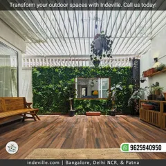 This stunning house courtyard transformation showcases my expertise in biophilic design. I used rich wooden flooring, a full-length vertical garden, and comfortable wooden seating to create a seamless connection with nature indoors.