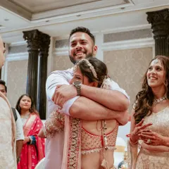 The emotional embrace between a bride and her brother is a moment that speaks volumes about family bonds.