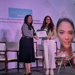 Receiving a certificate of appreciation for moderating the session. I am grateful for platforms like these that allow us to discuss important issues and advance the practice of aesthetic medicine in India.