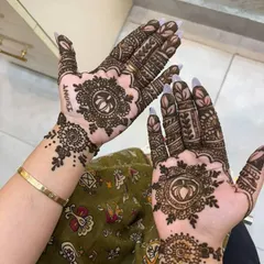 I love adding personal touches to my mehendi designs. In this photo, you can see the name 'Ishant' subtly incorporated into the intricate pattern, making the design unique and special for the client.