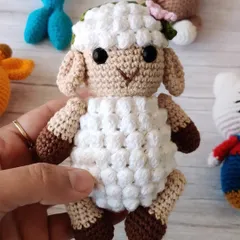 This sweet little crochet sheep with a flower in her hair is so soft and lovely. It's a perfect addition to a calm and gentle nursery theme.