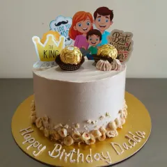This cake was for a "Happy Birthday Dadda" celebration. It's a hazelnut cake decorated with Ferrero Rocher chocolates and themed toppers for the "King of the house".