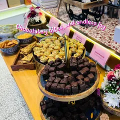 A glimpse of our elegant appetizer spread for a corporate event with Tira Beauty. We served delicious chocolatey brownie bites and savory mini tarts, proving that professional events can be full of fun flavors. Our presentation is designed to impress your guests from the first look.