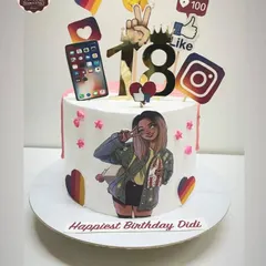 An 18th birthday cake for a social media lover. The design incorporates edible prints of social media icons, emojis, and a personalized cartoon illustration of the birthday girl.