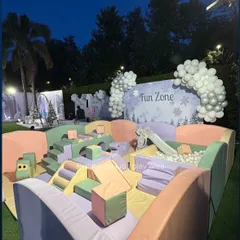 Our Pastel Dream setup looks magical, especially for evening events. This outdoor configuration features a ball pit, slide, and soft play blocks in gentle colors, creating a picture-perfect fun zone for any celebration.