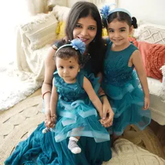 A "Mumma and me" session with two beautiful daughters. The coordinated teal dresses and the genuine smiles make this a heartwarming portrait of a mother's love.