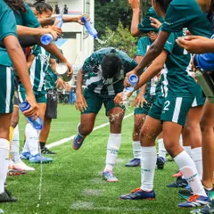A birthday celebration done the Kickstart way! Our players drench a teammate with water, a fun tradition that shows the strong bond and camaraderie within the squad.