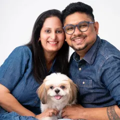 A couple and their fur baby. For many, pets are their first "children," and a portrait session is a wonderful way to celebrate that bond.