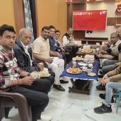 It's not all business. Here we are sharing a meal after a productive session. The friendships and informal chats are just as important as the magic itself.
