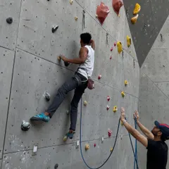 Trust between a climber and their belayer is essential in lead climbing. Our community is built on this foundation of support and shared passion.