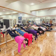 Upside down and having a great time! This group exercise using the ballet barre is a fun way to build upper body strength and enjoy a different perspective.