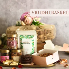 The Vrudhi Basket is a grand gesture, featuring a large, beautifully crafted round basket. It's perfect for filling with a wide assortment of our gourmet products.