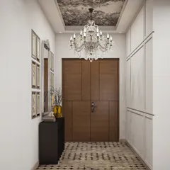 A luxurious foyer design featuring a grand crystal chandelier, patterned flooring, and a wallpapered ceiling, creating an impactful first impression.