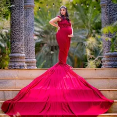 Celebrate your journey to motherhood with a powerful statement. This deep red trail gown is one of my most popular maternity photoshoot rentals, designed to create elegant silhouettes and timeless portraits.