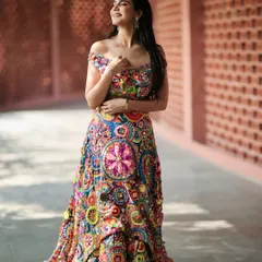 A happy, sun-kissed shot that brings out the joyful colors of the lehenga. I believe in creating looks that feel alive and full of personality.
