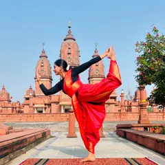 Performing Natarajasana at the Laxminarayan Temple. I believe every woman is powerful and beautiful, and this pose is an expression of that divine feminine strength and grace.