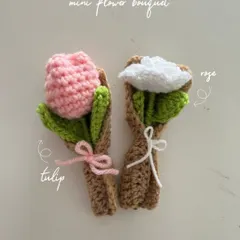 My mini flower bouquets are a unique gift. This image shows a pink tulip and a white rose, each wrapped in a tiny holder and tied with a bow.