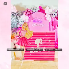 A close-up of the main Barbie display, highlighting the custom "Happy Birthday" neon sign and the striped pedestal design.