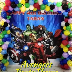 I bring superhero adventures to life with action-packed themes. This Avengers party for Taran's 4th birthday featured a custom printed backdrop of the whole team, framed by a colorful balloon arch to create an exciting photo corner.
