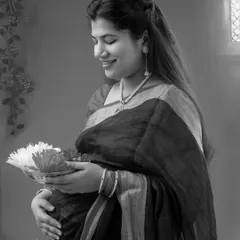 A black and white version of the traditional portrait, which adds a timeless and classic feel. It highlights the mother's serene expression and the intricate details of her attire.