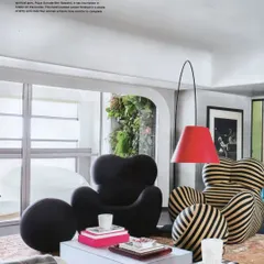 The living room of Project 86 as featured in Livingetc. The article highlights the mix of a contemporary bubble couch and a classic Up chair, creating a formal yet relaxed feel.