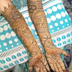 A stunning example of full coverage bridal henna. The design is packed with detail, leaving very little negative space for a truly traditional look.