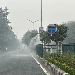 Here you can see my misting system creating a fine fog along a busy road. This mist effectively captures dust raised by traffic and other pollutants, cleaning the air for commuters and residents. This is a practical and effective urban dust suppression solution.