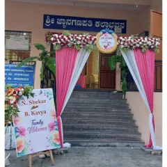 A clear view of the entrance decoration, showing the custom welcome board and the floral arrangement on top of the arch. We ensure every detail, from the flowers to the signage, is perfect.