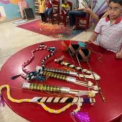 The children admiring their handiwork before the Ramleela performance. Making their own props gives them a sense of ownership and makes the story come alive.