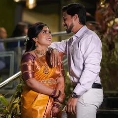 Chaitra and her partner. This photo gives a good view of her engagement look, including the neatly draped saree and elegant hairstyle.