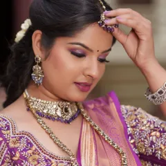 The right fit and details make all the difference. This image showcases the intricate work and perfect tailoring of the purple embroidered blouse, along with the matching jewelry.