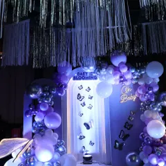 For our 'Baby is Blooming' theme, I created this enchanting butterfly wonderland. The purple and silver balloons, shimmering streamers, and fluttering butterflies made for a magical photo backdrop.