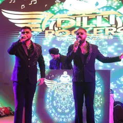 Our dual male vocalists, the heart of our high-energy performances. Their dynamic chemistry on stage is what gets the crowd hyped up and singing along.