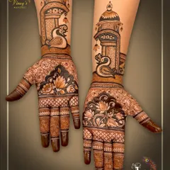 Another view of the designer swan and lotus mehndi, showcasing the symmetry and intricate details across both hands.