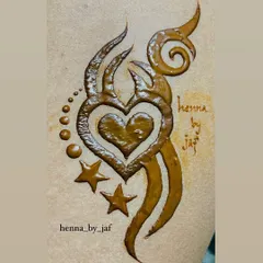 A bold, tribal-style henna tattoo featuring a heart at its center, surrounded by stars and swirls.