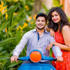 A sweet and relaxed moment on a bright blue scooter. This prop adds a fun, retro vibe to the pre-wedding shoot, perfect for a casual and happy couple portrait.