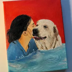 A vibrant and emotional pet portrait of a woman kissing her golden retriever in the water. The bright red background makes the blue water and the subjects pop.