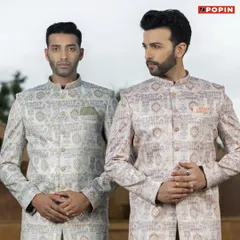 Here you can see two variations of my printed Jodhpuri jackets, one in a lighter tone and one with warmer accents. This shows how the same style can create different moods, perfect for a groom and groomsman duo.