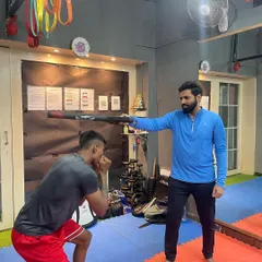 Head movement is key to avoiding getting hit. I use a boxing reflex bar to drill defensive techniques, forcing the student to stay sharp and react quickly.