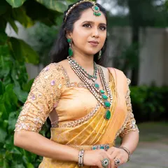 This look from my 'Athiloka Sundari' series features me in a pure Kanchi saree. I paired it with a blouse adorned with intricate embroidery and semi-precious stone embellishments, creating a regal outfit designed to make any bride feel like a princess.