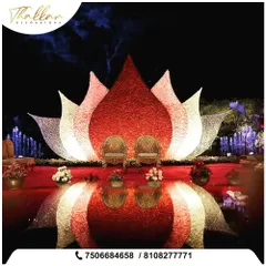For a reception that leaves everyone speechless, I designed this magnificent lotus-shaped stage. The structure, combined with dramatic lighting and water features, created a truly magical and one-of-a-kind centerpiece for the evening's celebration.