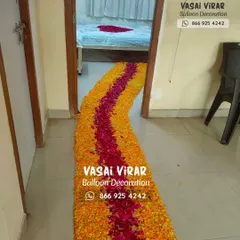 A simple and beautiful way to welcome the baby home. This is a long pathway made from yellow marigold and red rose petals, leading from the main door directly to the parents' room.