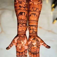 For this bride, we blended traditional motifs with personal memories. Her design includes portraits of Radha and Krishna alongside the skylines of San Francisco and New York City, representing special places in her life.