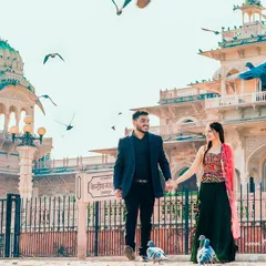 A candid walk through a historic Jaipur location, with pigeons taking flight to add a touch of dynamic energy to this romantic city pre-wedding shoot.