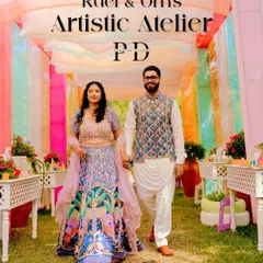 The couple's entrance at their 'Artistic Atelier' Haldi. The colorful draped tunnel and creative details set the stage for a one-of-a-kind celebration that reflected their personalities.