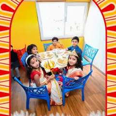 Celebrating festivals is a big part of our community. Here, children dressed in beautiful traditional attire for Pujo enjoy a special meal together, making memories and learning about culture.