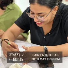Here's a snapshot from one of my tote bag painting workshops. The focus and joy on her face say it all! You can have this same creative experience at home with a DIY kit, perfect for a relaxing evening project.